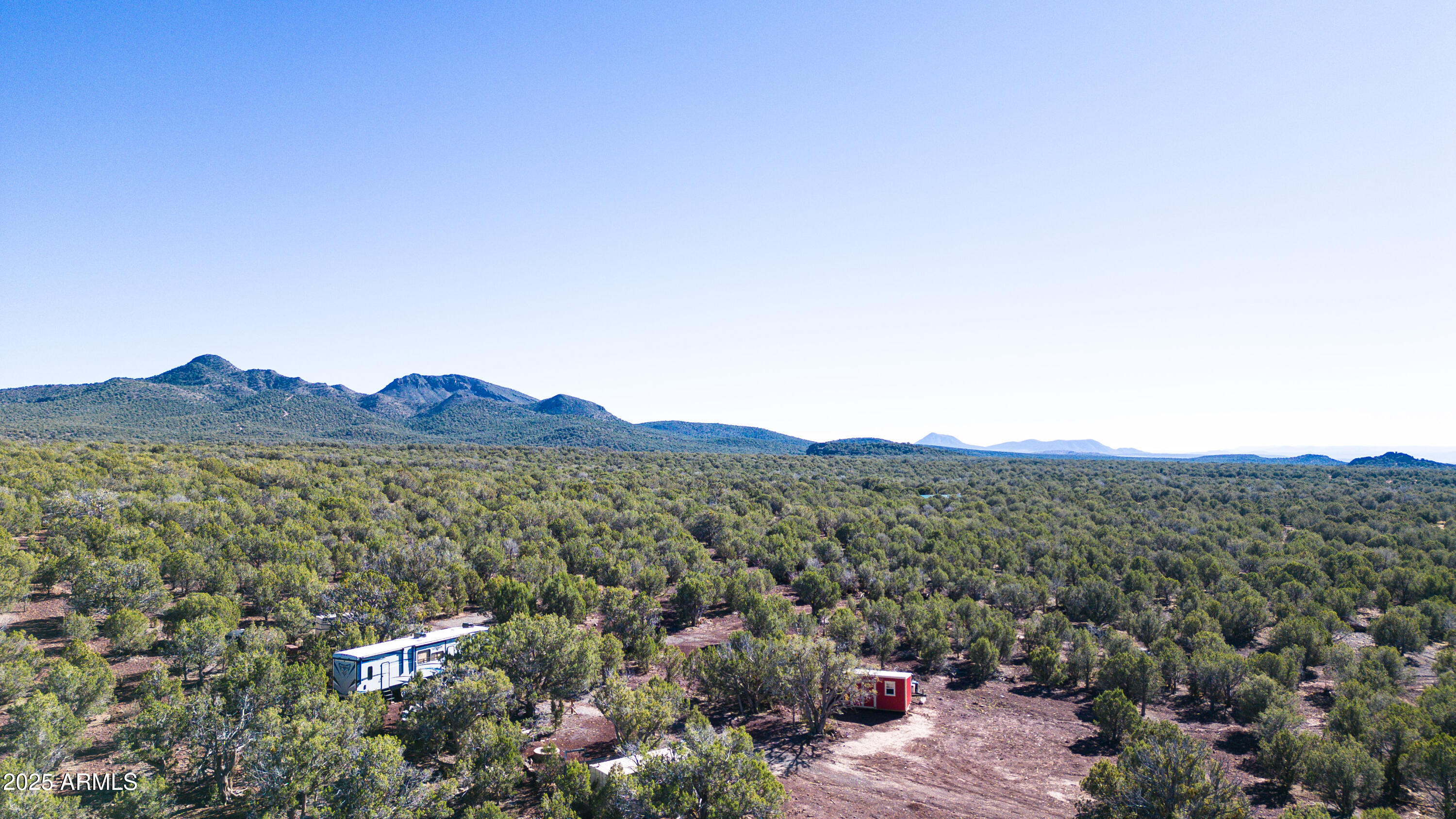 a view of a house with a mountain