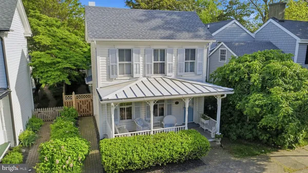front view of a house with a garden