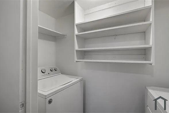 7129 Sorcey Road Dallas, TX 75249 - Photo 13 of 17 Washroom featuring washer / dryer