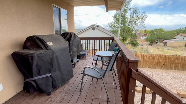 1797 Sunset Road Enoch, UT 84721 - Photo 53 of 80 Spacious outdoor deck featuring wood-finish flooring and a wood railing