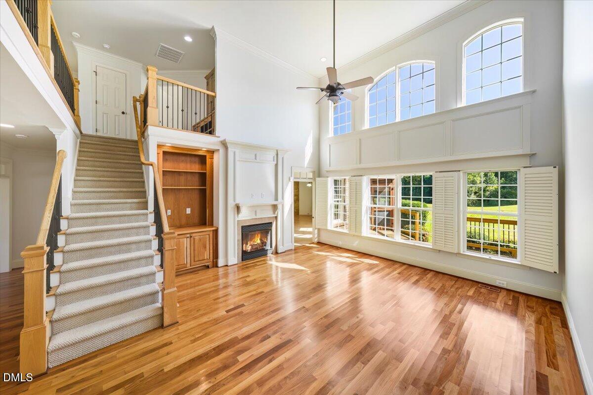 324 Waterville Street Raleigh, NC 27603 - Photo 17 of 82 a view of an empty room with wooden floor and a window