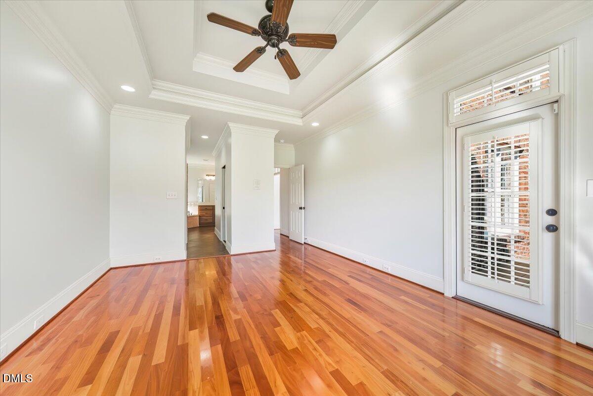 324 Waterville Street Raleigh, NC 27603 - Photo 18 of 82 a view of empty room with wooden floor and fan