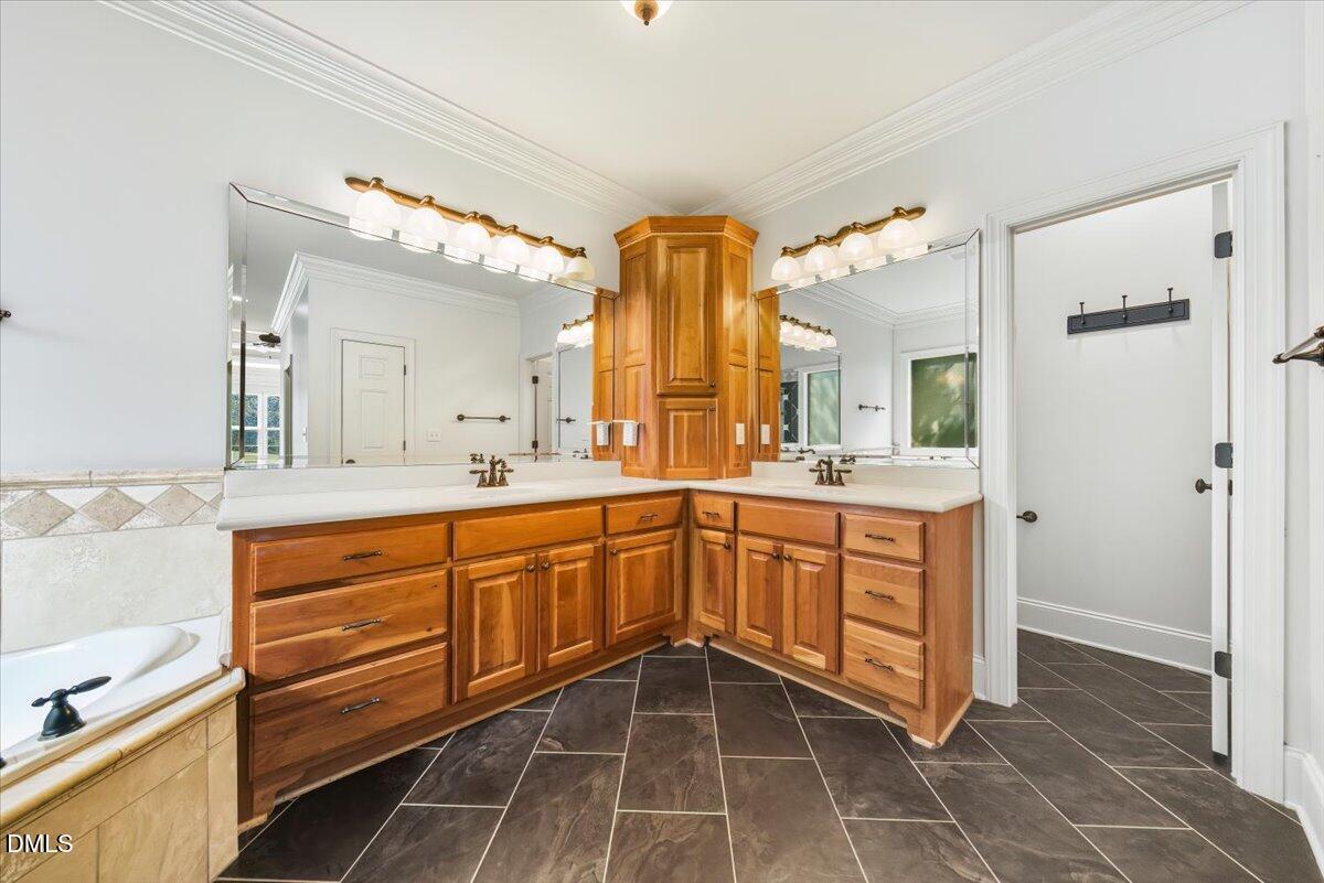 324 Waterville Street Raleigh, NC 27603 - Photo 20 of 82 a spacious bathroom with a mirror sink and double