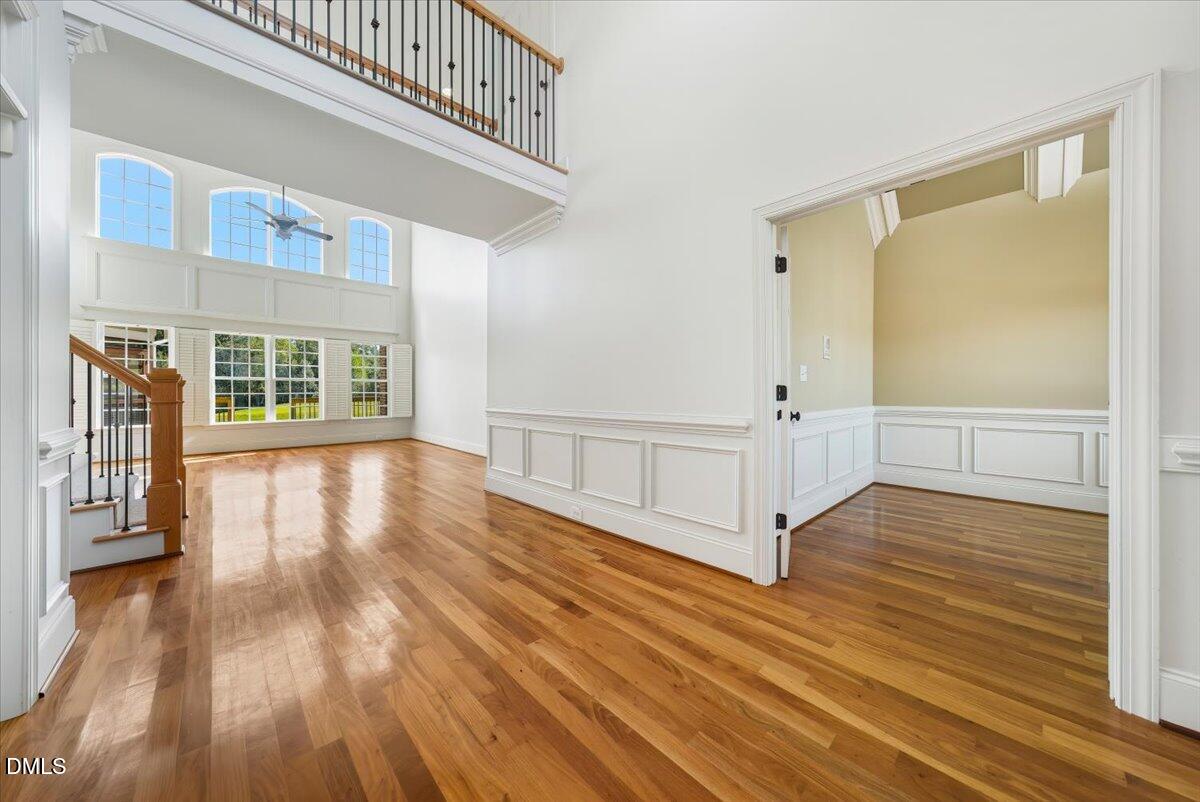 324 Waterville Street Raleigh, NC 27603 - Photo 23 of 82 a view of a hallway with wooden floor and staircase
