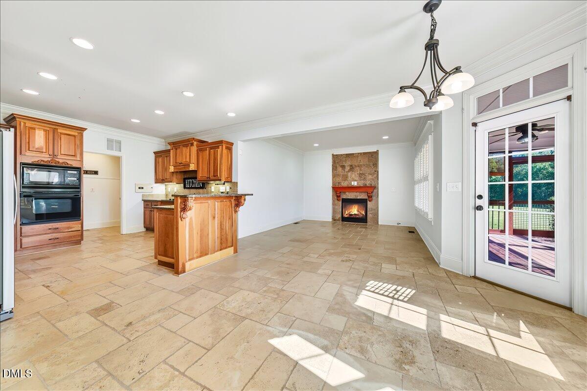 324 Waterville Street Raleigh, NC 27603 - Photo 28 of 82 a view of a electric appliances in kitchen and empty room with windows