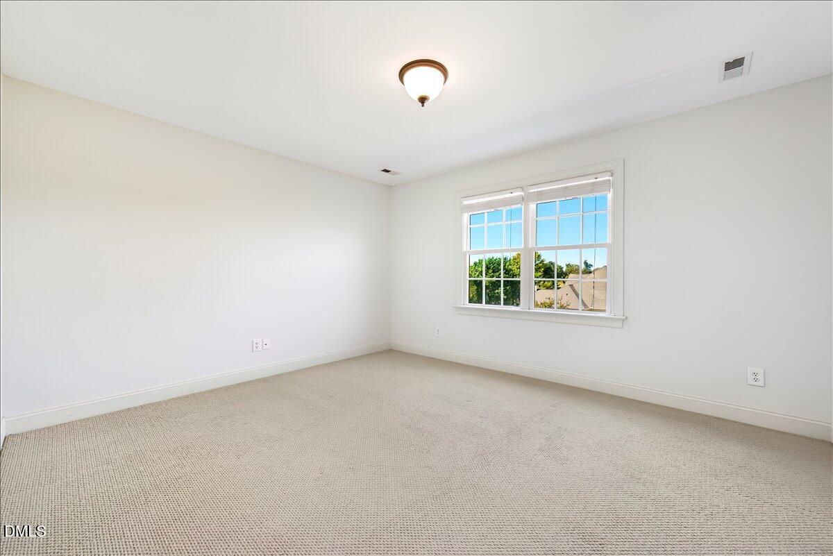 324 Waterville Street Raleigh, NC 27603 - Photo 35 of 82 a view of an empty room with a window