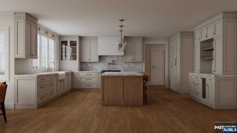 501 Sterling Place Ridgewood, NJ 07450 - Photo 2 of 8 a kitchen with white cabinets and white appliances