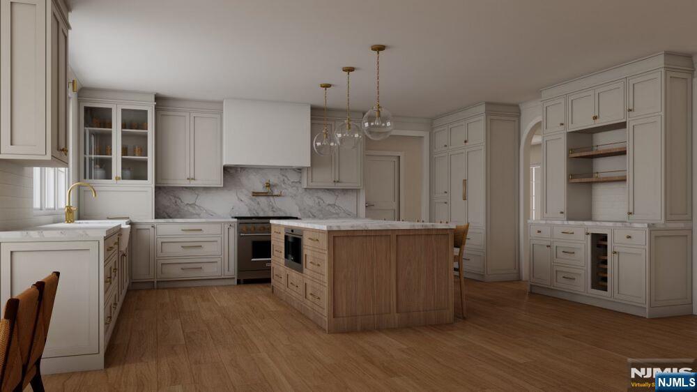 501 Sterling Place Ridgewood, NJ 07450 - Photo 3 of 5 a kitchen with white cabinets and white appliances