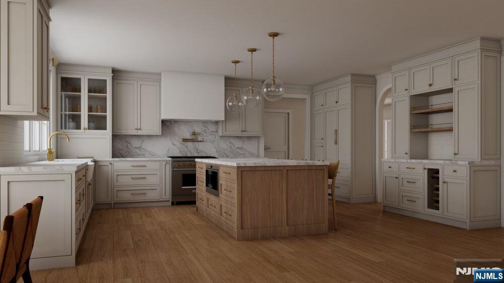 501 Sterling Place Ridgewood, NJ 07450 - Photo 3 of 8 a kitchen with white cabinets and white appliances