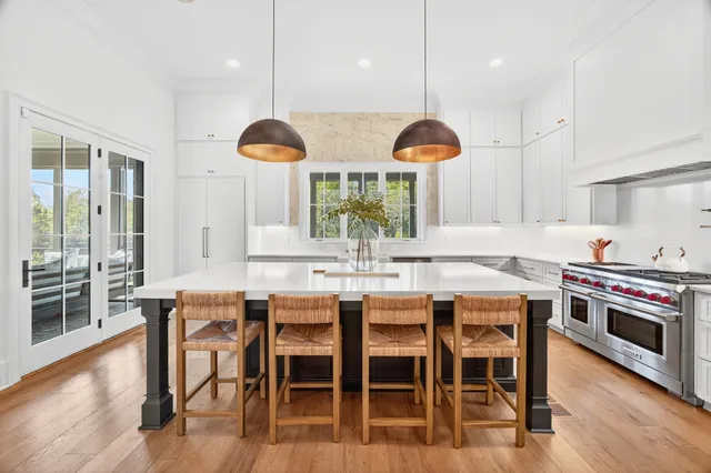 a bathroom with a granite countertop sink a toilet and a mirror