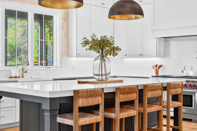 a bedroom with a bed flat screen tv and a large window