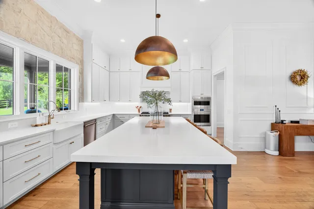 a spacious bathroom with a sink a toilet and shower