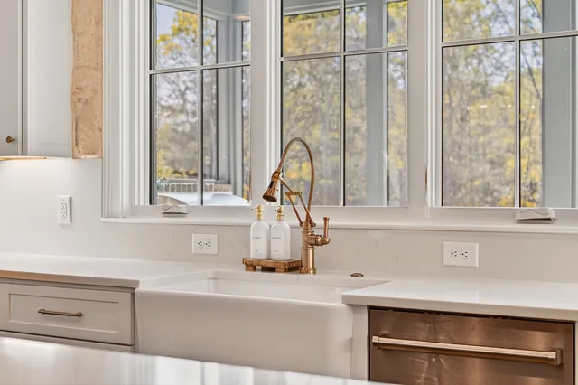 a view of a hallway with wooden floor and entryway