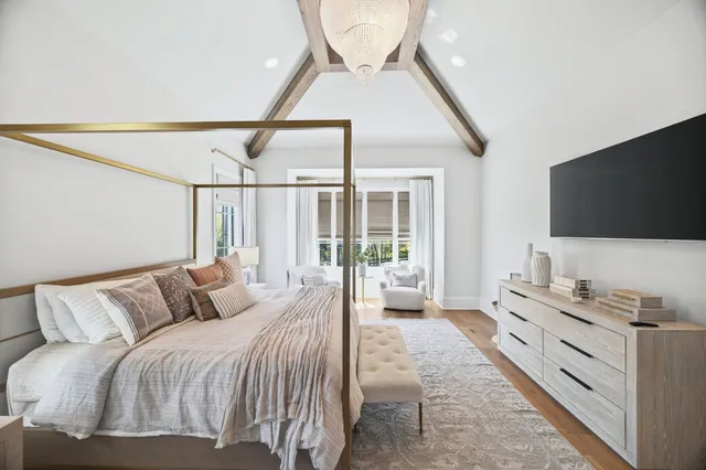 a living room with fireplace furniture and a flat screen tv
