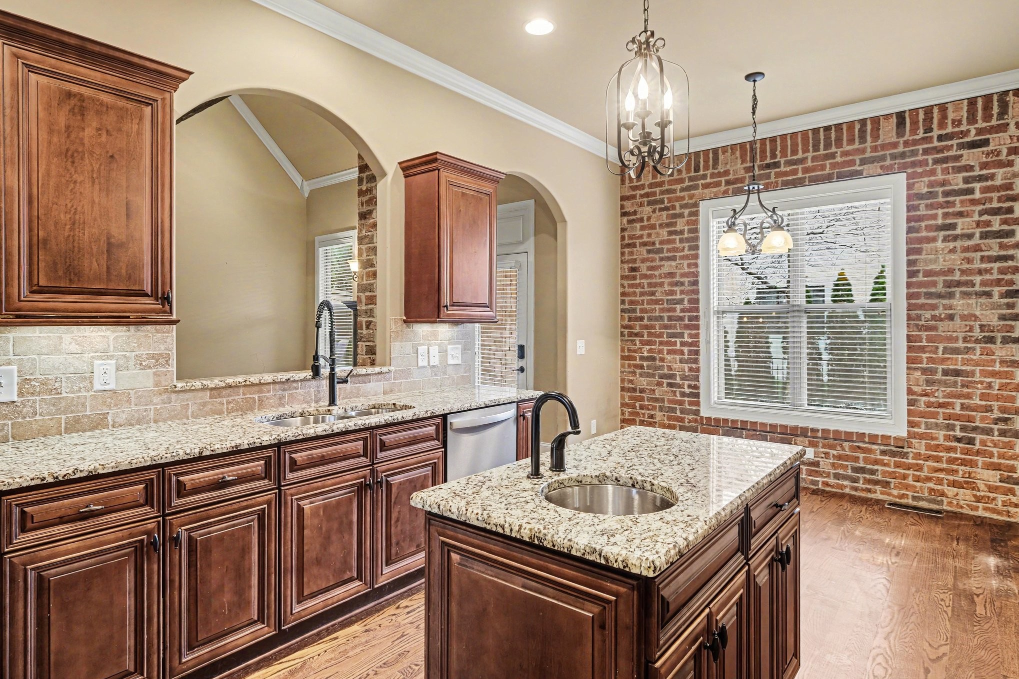1017 Alice Springs Circle Spring Hill, TN 37174 - Photo 15 of 35 a kitchen with granite countertop a sink a counter top space and cabinets