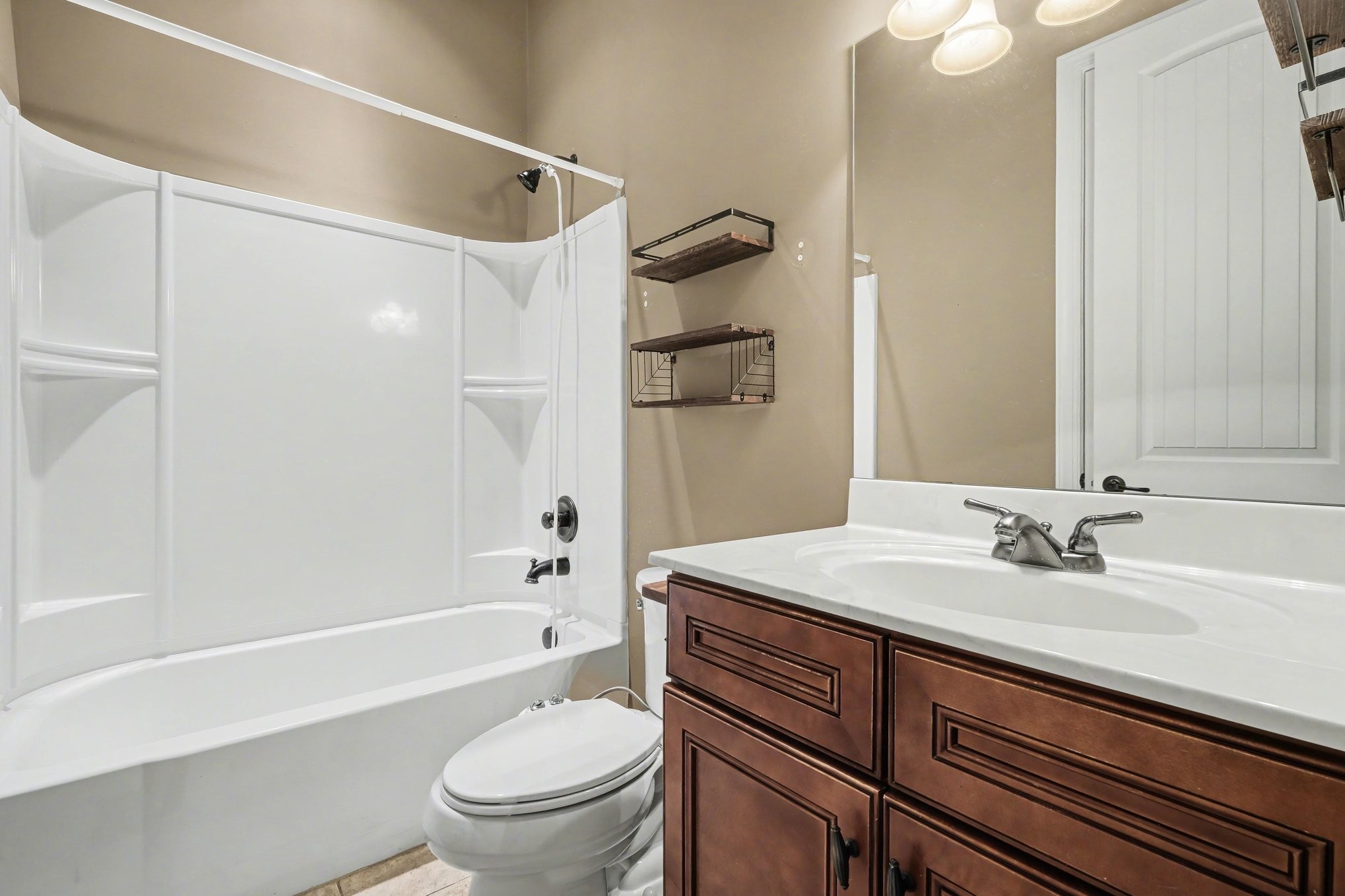 1017 Alice Springs Circle Spring Hill, TN 37174 - Photo 24 of 35 a bathroom with a sink a toilet and a bathtub