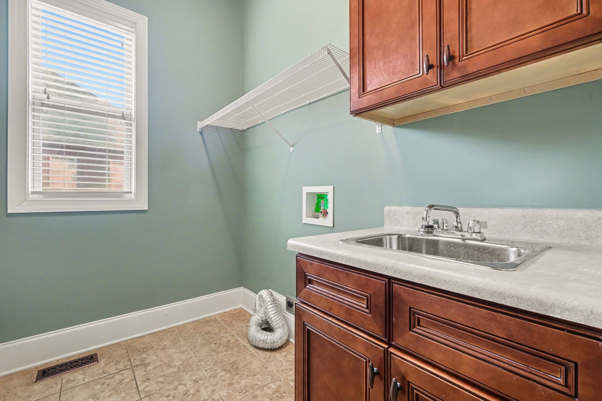 1017 Alice Springs Circle Spring Hill, TN 37174 - Photo 25 of 35 a bathroom with a sink and a mirror