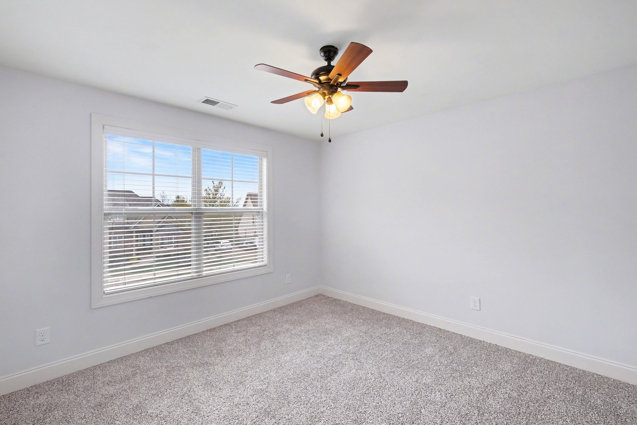 1017 Alice Springs Circle Spring Hill, TN 37174 - Photo 26 of 35 a view of a livingroom with a ceiling fan and window