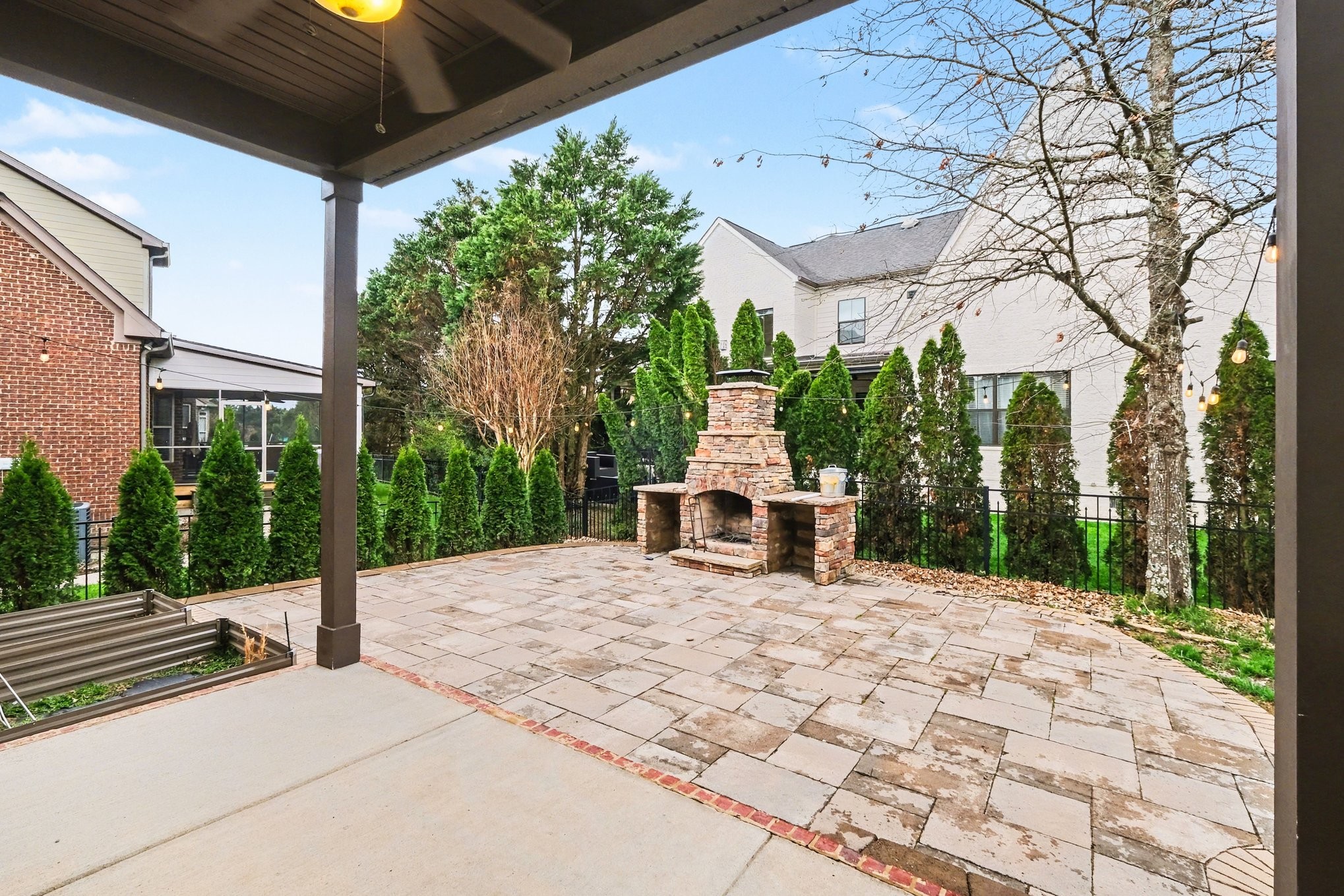 1017 Alice Springs Circle Spring Hill, TN 37174 - Photo 33 of 35 a view of a patio with a table and chairs and wooden fence