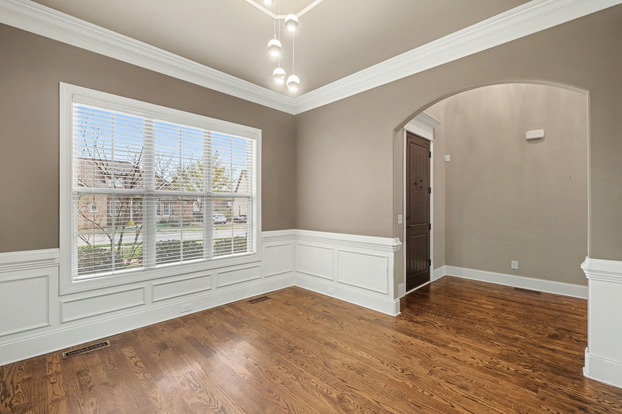 1017 Alice Springs Circle Spring Hill, TN 37174 - Photo 6 of 35 an empty room with wooden floor and windows