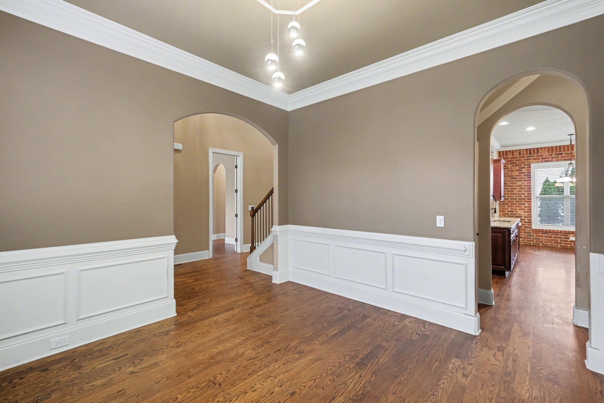 1017 Alice Springs Circle Spring Hill, TN 37174 - Photo 7 of 35 wooden floor in an empty room with a window