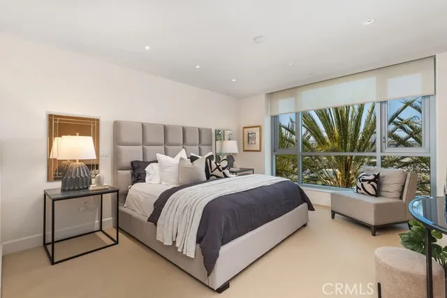 a bedroom with bed and a lamp