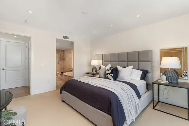 a bathroom with a tub a sink and a shower