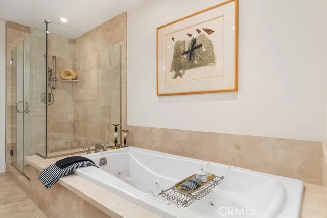 a bathroom with a double vanity sink mirror double and shower
