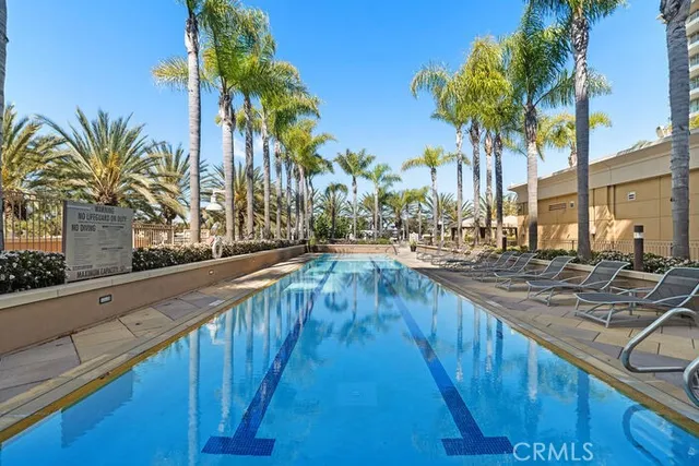 a view of swimming pool with outdoor seating