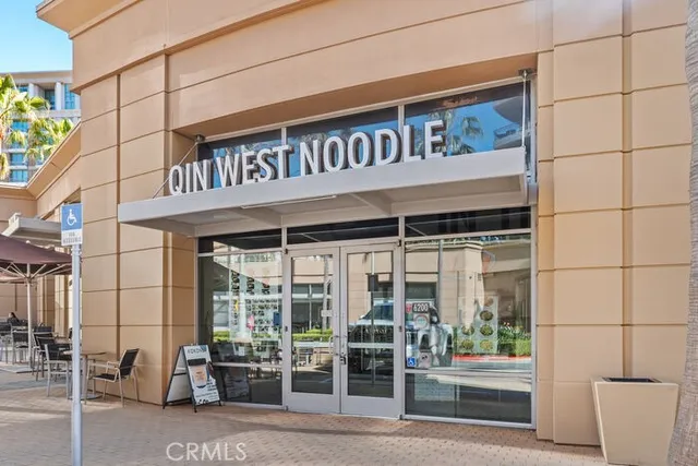 a view of a cafe with sitting area