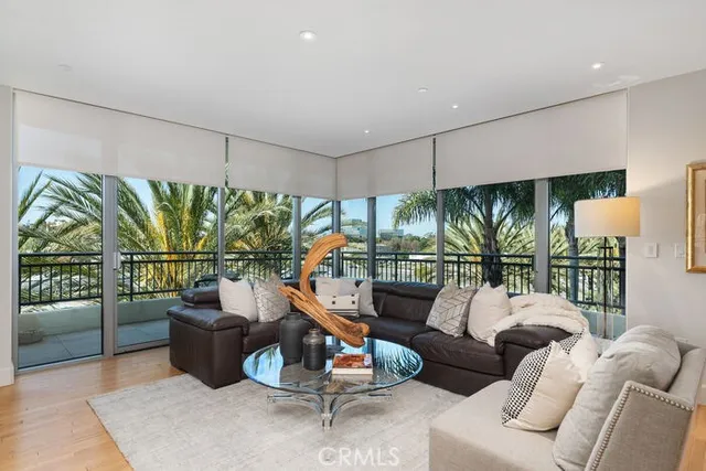 a balcony with furniture and a potted plant