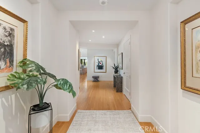 a kitchen with a table chairs sink refrigerator and microwave