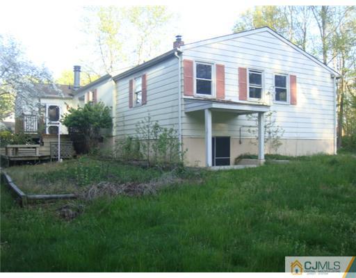 1565 Englishtown Road Old Bridge, NJ 08857 - Photo 2 of 11 a front view of a house with a yard