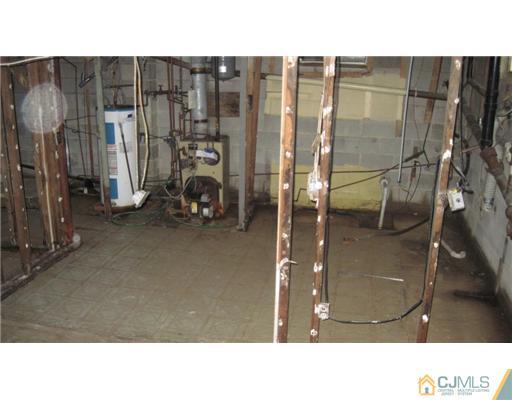1565 Englishtown Road Old Bridge, NJ 08857 - Photo 5 of 11 a picture of a bathroom with a sink