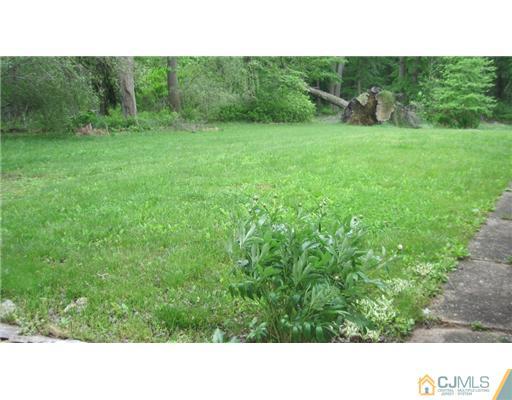1565 Englishtown Road Old Bridge, NJ 08857 - Photo 10 of 11 a open area with trees in the background