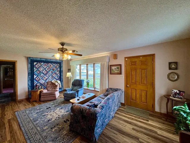 a bedroom with bed and a chandelier