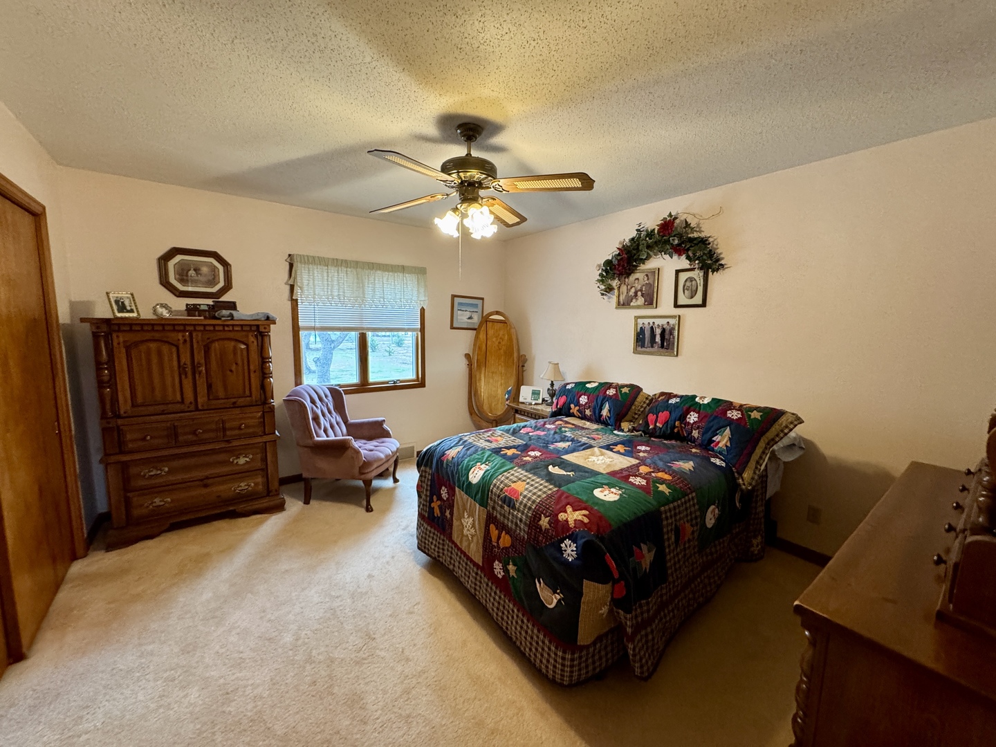 113 West 3rd Street Wyanet, IL 61379 - Photo 13 of 31 a bedroom with bed and a chandelier