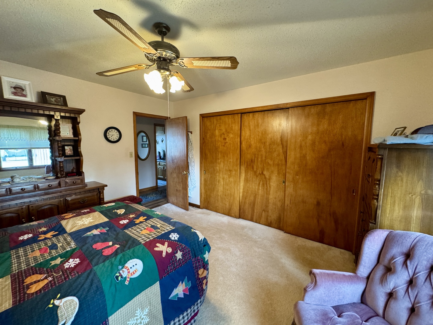 113 West 3rd Street Wyanet, IL 61379 - Photo 14 of 31 a bedroom with a bed and a chandelier
