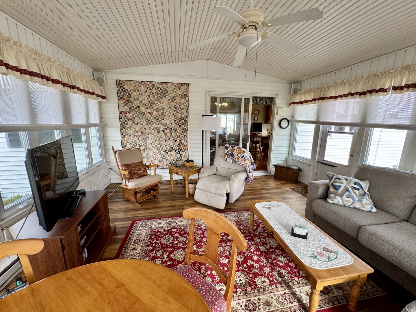 113 West 3rd Street Wyanet, IL 61379 - Photo 17 of 31 a living room with furniture fireplace and large window