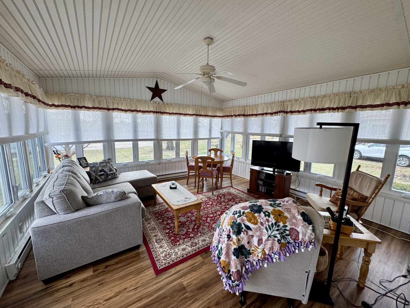 113 West 3rd Street Wyanet, IL 61379 - Photo 19 of 31 a living room with furniture and a flat screen tv