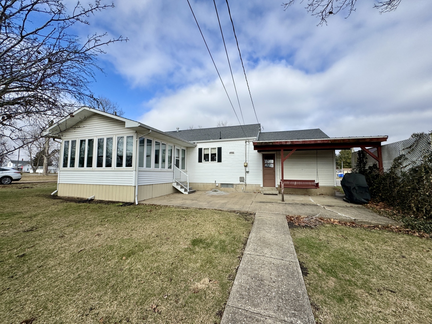 113 West 3rd Street Wyanet, IL 61379 - Photo 25 of 31 a view of a house with backyard and sitting area