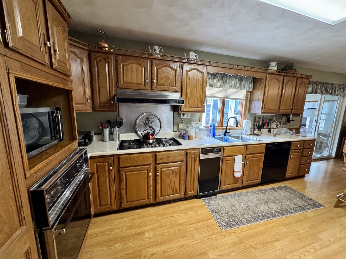 113 West 3rd Street Wyanet, IL 61379 - Photo 9 of 31 a kitchen with stainless steel appliances granite countertop a sink stove and cabinets