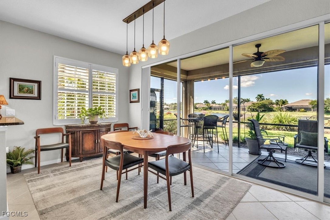 3711 Pebblebrook Ridge Court, Unit 101 Fort Myers, FL 33905 - Photo 15 of 50 a view of a dining room with furniture window and outside view