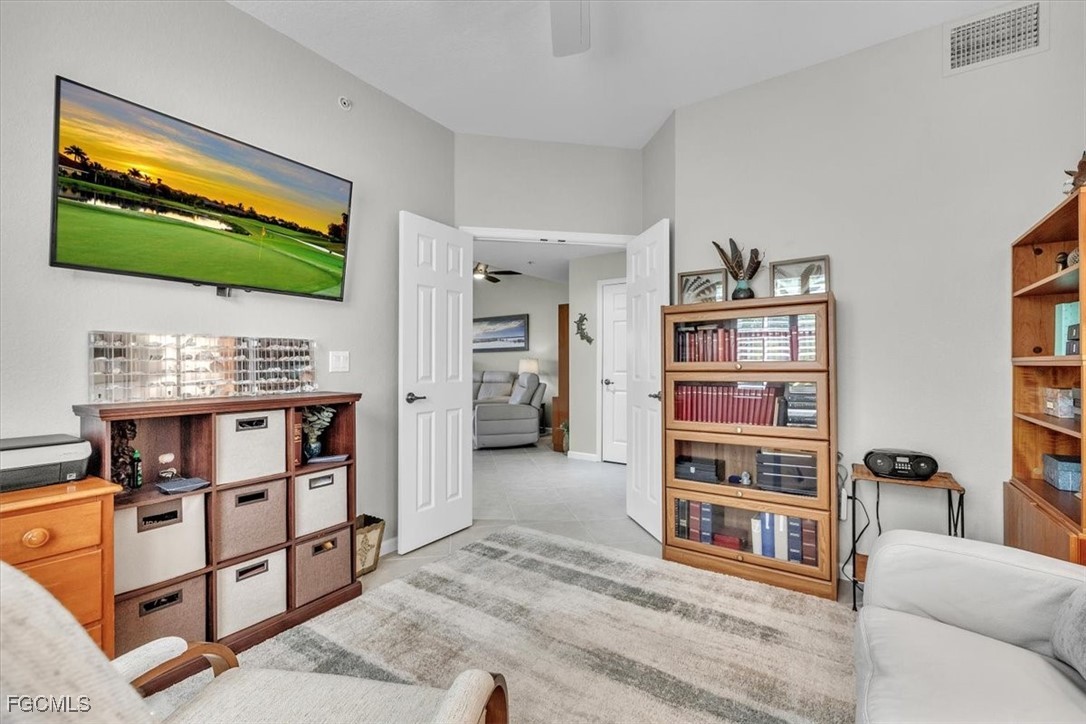 3711 Pebblebrook Ridge Court, Unit 101 Fort Myers, FL 33905 - Photo 27 of 50 a living room with furniture and a flat screen tv