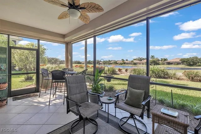 a balcony with furniture and a potted plant