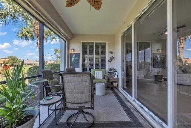 a view of a porch with furniture and yard