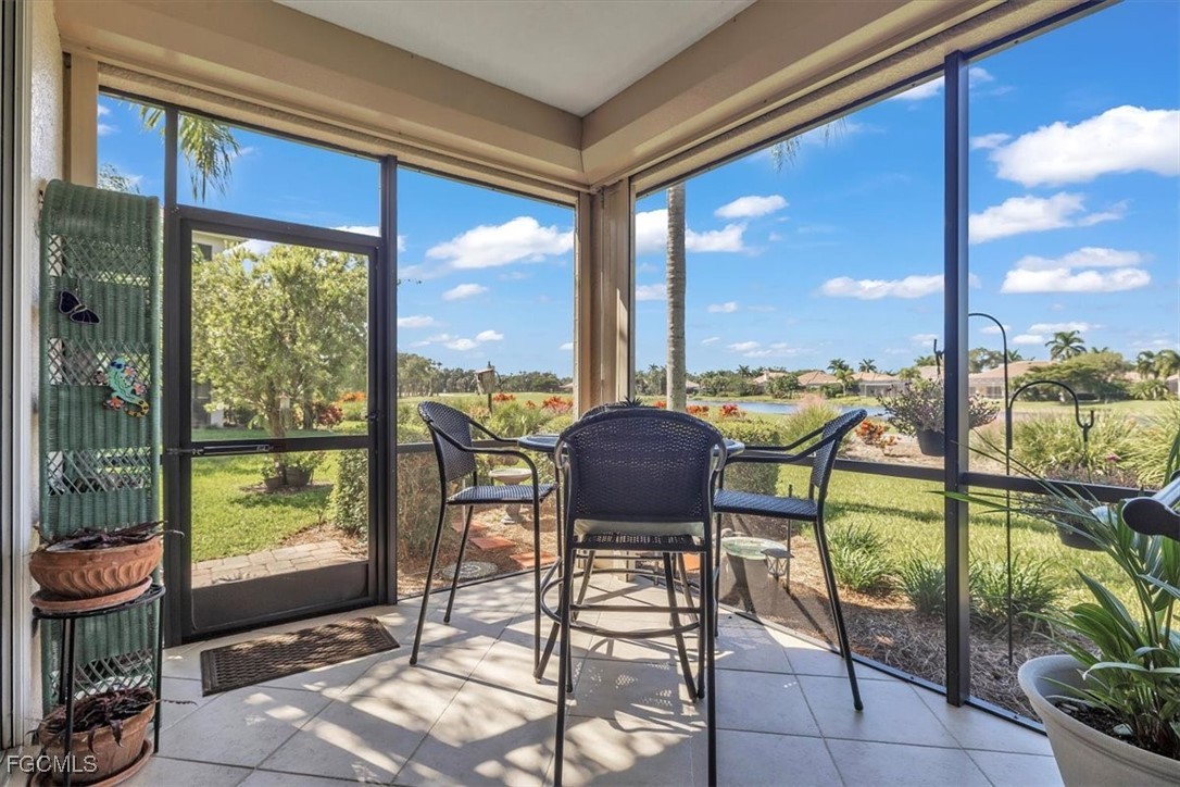 3711 Pebblebrook Ridge Court, Unit 101 Fort Myers, FL 33905 - Photo 35 of 50 a view of a porch with furniture and yard
