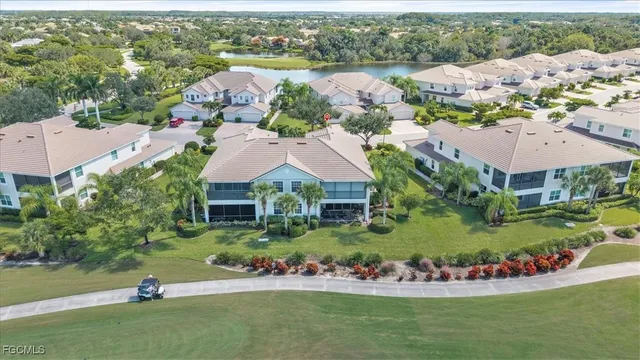an aerial view of a house with a lake view