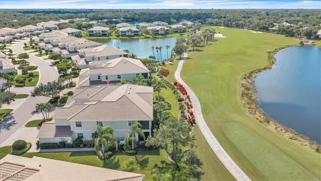 an aerial view of a house with a lake view