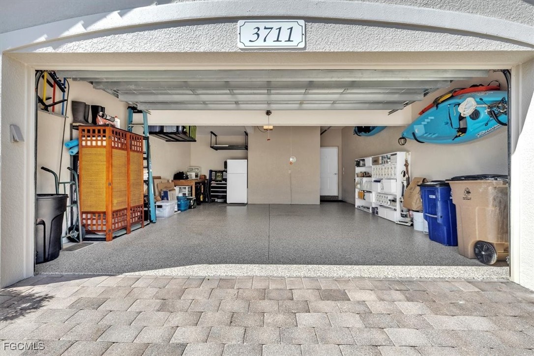 3711 Pebblebrook Ridge Court, Unit 101 Fort Myers, FL 33905 - Photo 40 of 50 a view of a garage